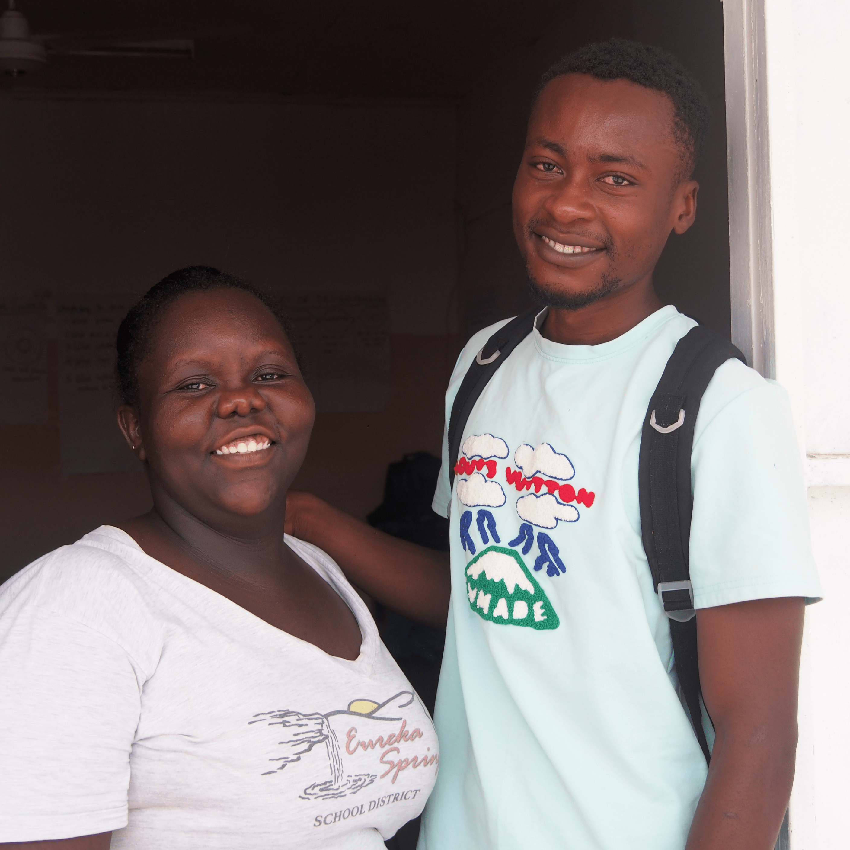 Mentor with student smiling
