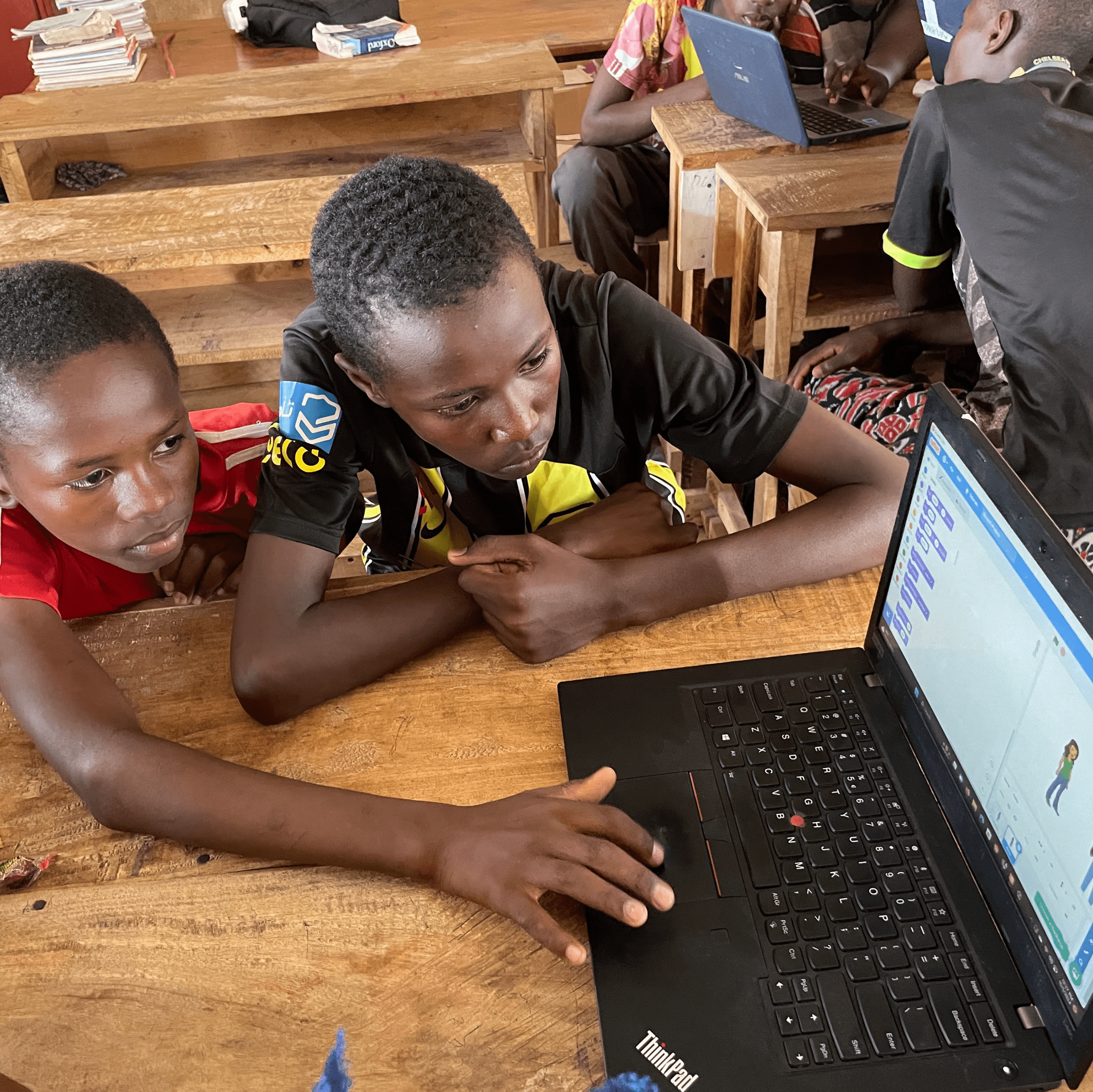 Students exploring STEM on a laptop